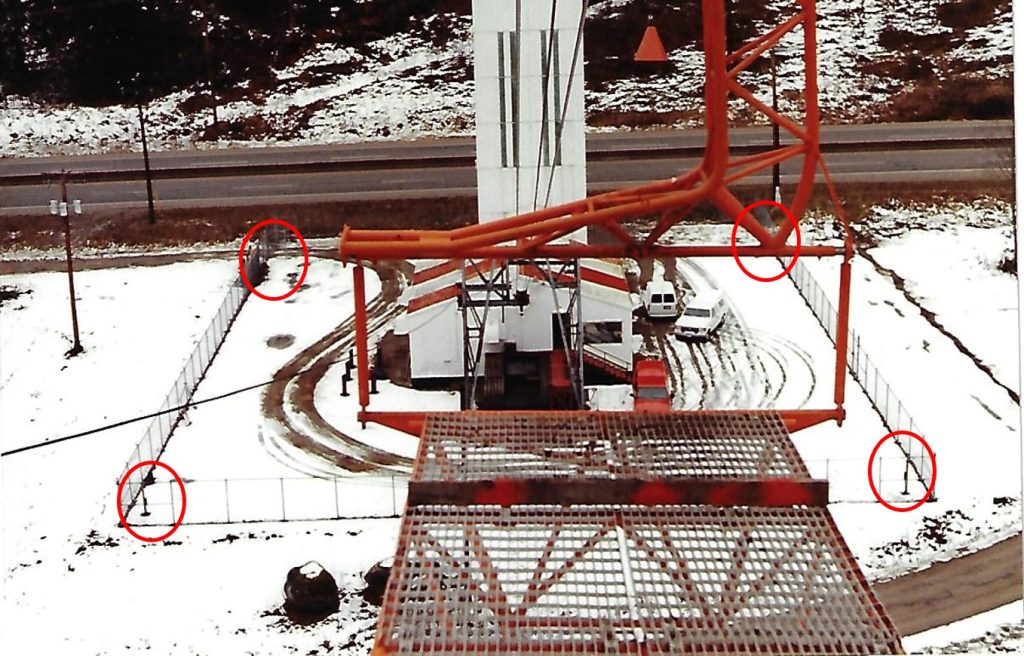 CNCP Mt. Jarvis tramway base station 1994. Compound view from tram car.  Circles denote twin photo-beam perimeter detection, part of a 3 stage site alarm system installed by A.S.C. Feb 1994  